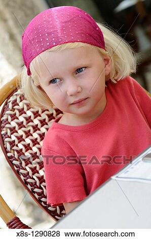 Stock Photo - Stock photo of a four year old girl waiting at a restaurant table. Fotosearch
