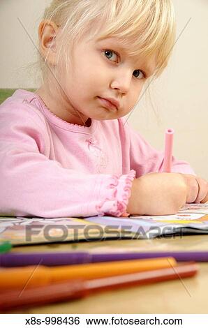 Stock photo of a four year old girl drawing pictures on a piece of paper View Large Photo Image Stock Photograph - Stock photo of a four year old girl drawing pictures on a piece of paper. Fotosearch