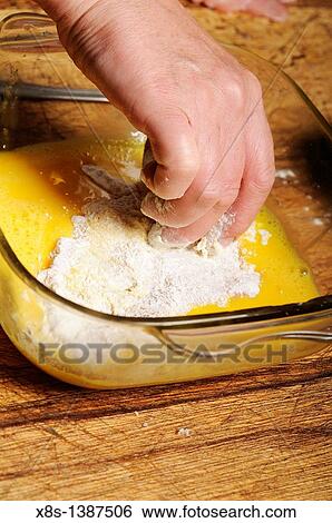 Stock photo of a turkey escalope being dipped into flour View Large Photo Image Stock Photograph - Stock photo of a turkey escalope being dipped into flour. Fotosearch