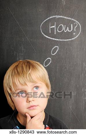 Stock photo of a young boy in fornt of a blackboard with chalk thought bubbles spelling the word how View Large Photo Image Stock Image - Stock photo of a young boy in fornt of a blackboard with chalk thought bubbles spelling the word how. Fotosearch