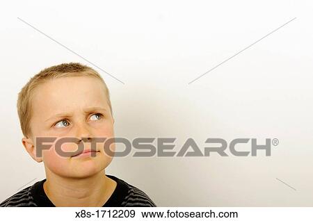 Stock Photo of a young boy thinking View Large Photo Image Stock Photo - Stock Photo of a young boy thinking. Fotosearch