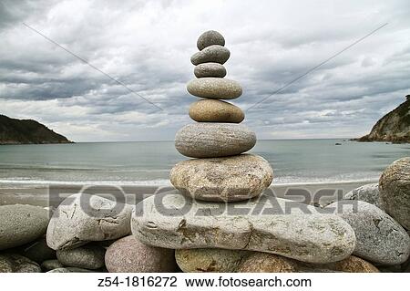 Stock Image - Stone cairn in La Concha de Artedo beach, Cudillero, Asturias, Spain. Fotosearch