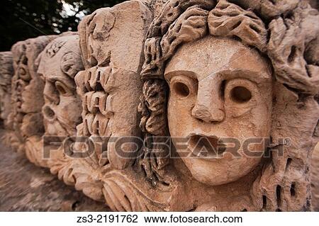 Stone carvings of theatre masks at ruins of Myra, Antalya Region, Turkish Riviera, Turkey, Europe. View Large Photo Image Stock Image - Stone carvings of theatre masks at ruins of Myra, Antalya Region, Turkish Riviera, Turkey, Europe.. Fotosearch