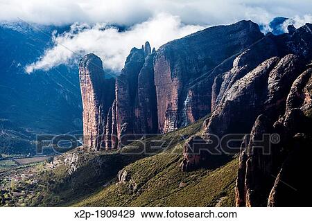 Stone cliffs of Mallos de Riglos, Huesca, Aragon, Spain View Large Photo Image Stock Photo - Stone cliffs of Mallos de Riglos, Huesca, Aragon, Spain. Fotosearch