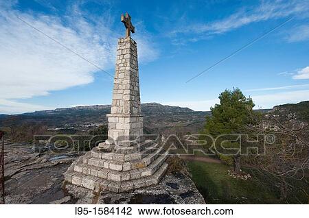 Stone cross at the limits of the small rock-perched village of Siurana, Tarragona province, Catalonia, Spain View Large Photo Image Stock Image - Stone cross at the limits of the small rock-perched village of Siurana, Tarragona province, Catalonia, Spain. Fotosearch