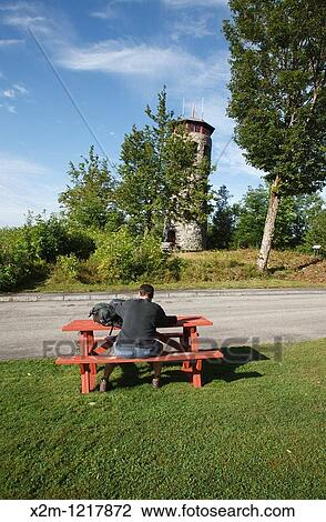 Stock Image - Stone Fire Tower at John Wingate Weeks Estate on the summit of Mt Prospect in Lancaster, New Hampshire USA The Mount Prospect Tower was built by John W Weeks in 1912 and is still in operation today. Fotosearch