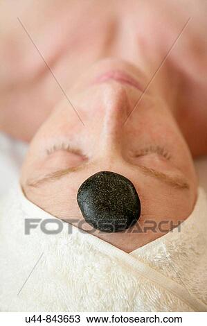 Stock Image - Stone head theraphy. Fotosearch