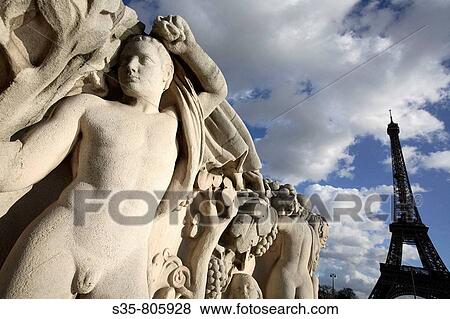 Stone sculptures at the base of the Chaillot pool with Eiffel Tower in background, Paris. France View Large Photo Image Stock Photo - Stone sculptures at the base of the Chaillot pool with Eiffel Tower in background, Paris. France. Fotosearch