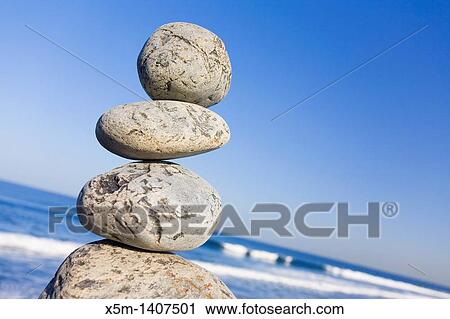Stone stack with blue sky and angled horizon View Large Photo Image Stock Image - Stone stack with blue sky and angled horizon. Fotosearch