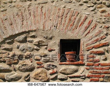 Stone wall enclosing and old brick arch in a town, Southern France View Large Photo Image Stock Photo - Stone wall enclosing and old brick arch in a town, Southern France. Fotosearch