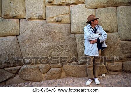 Stone wall of the old sovereign Inca Roca's palace, now part of the Archbishop's Palace in the Hatun Rumiyoc street. The main feature is a twelve-angled stone in the middle of the wall. Cusco, Peru View Large Photo Image Stock Image - Stone wall of the old sovereign Inca Roca's palace, now part of the Archbishop's Palace in the Hatun Rumiyoc street. The main feature is a twelve-angled stone in the middle of the wall. Cusco, Peru. Fotosearch