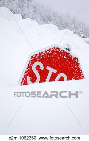Stop sign sticking out of snow bank at C L Graham Wangan Grounds Scenic Overlook along the Kancamagus Highway route 112, which is one of New England's scenic byways after a snow storm Located in the White Mountains, New Hampshire USA View Large Photo Image Stock Image - Stop sign sticking out of snow bank at C L Graham Wangan Grounds Scenic Overlook along the Kancamagus Highway route 112, which is one of New England's scenic byways after a snow storm Located in the White Mountains, New Hampshire USA. Fotosearch