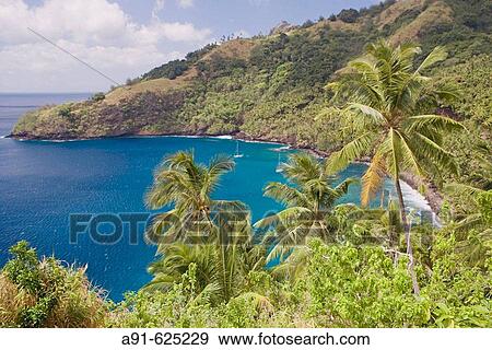 Stock Photo - Stopover in Hapatoni, Tahuata island. Cruise on Aranui III, cargo and passenger vessel, delivering goods to Marquesas and Tuamotus islands from Tahiti and picking coprah, fruits and fishes on her way back. Marquesas archipelago. French Polynesia. Fotosearch