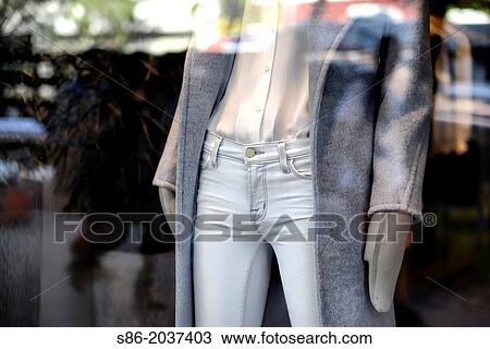 Store Window Mannequin wearing tight, light blue jeans, white shirt blouse, warm fleecy coat and warm mittens, New York City View Large Photo Image Stock Image - Store Window Mannequin wearing tight, light blue jeans, white shirt blouse, warm fleecy coat and warm mittens, New York City. Fotosearch