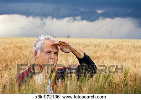 Storm chaser Tim Marshall in a prairie field in western Kansas, USA, June 10, 2009 View Large Photo Image Stock Photograph - Storm chaser Tim Marshall in a prairie field in western Kansas, USA, June 10, 2009. Fotosearch