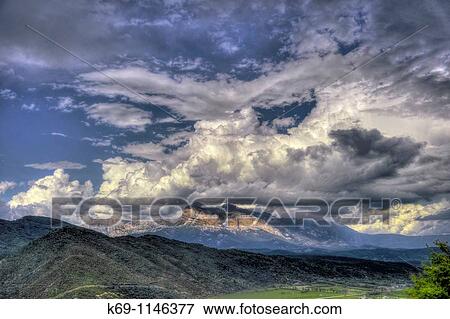 Stock Photo - Storm Cloud over Pea Montanesa, Sieste, Huesca province, Pyrenees, Spain. Fotosearch