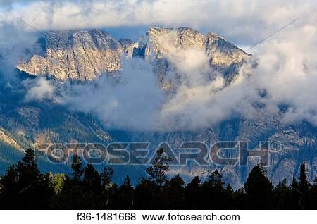 Storm clouds in morning over mountains in the Teton Range, Grand Teton National Park, Wyoming View Large Photo Image Stock Photo - Storm clouds in morning over mountains in the Teton Range, Grand Teton National Park, Wyoming. Fotosearch