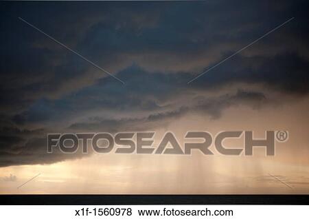 Stormy rain clouds over Cardigan Bay, Aberystwyth Wales UK View Large Photo Image Stock Photo - Stormy rain clouds over Cardigan Bay, Aberystwyth Wales UK. Fotosearch