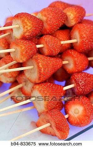 Strawberry skewers. Chocolate and Cacao Show, Barcelona, Catalonia, Spain View Large Photo Image Stock Photography - Strawberry skewers. Chocolate and Cacao Show, Barcelona, Catalonia, Spain. Fotosearch
