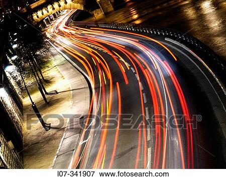 Stream of car headlights along the banks of the Seine at night. Paris. France View Large Photo Image Stock Photo - Stream of car headlights along the banks of the Seine at night. Paris. France. Fotosearch