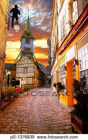 street at sunset with church and half timbered building Honfleur, Normandy, France View Large Photo Image Stock Photo - street at sunset with church and half timbered building Honfleur, Normandy, France. Fotosearch