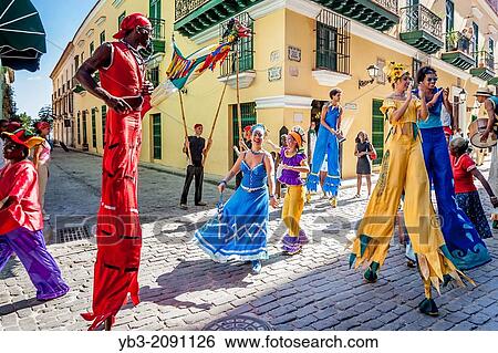 Street Entertainers Dancing On Stilts, Old Havana, Havana, Cuba. View Large Photo Image Stock Photograph - Street Entertainers Dancing On Stilts, Old Havana, Havana, Cuba.. Fotosearch
