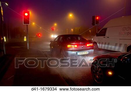 Street exhaust fumes in fog View Large Photo Image Picture - Street exhaust fumes in fog. Fotosearch