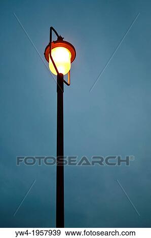 Street lamp at dusk. View Large Photo Image Stock Photo - Street lamp at dusk.. Fotosearch