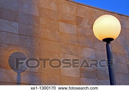 Stock Image - Street lamp beside mortuary building, gava, Catalonia, Spain.. Fotosearch