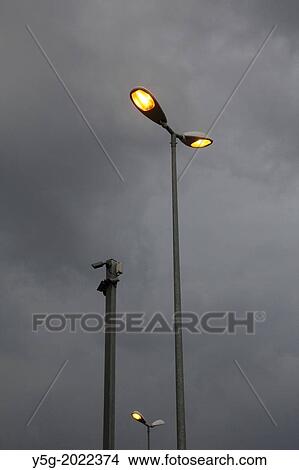 street lamps and dark rain clouds in rome italy. View Large Photo Image Picture - street lamps and dark rain clouds in rome italy.. Fotosearch