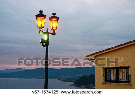 Street light at dusk San Roque viewpoint. Lastres, Asturias province, Spain. View Large Photo Image Stock Photography - Street light at dusk San Roque viewpoint. Lastres, Asturias province, Spain.. Fotosearch