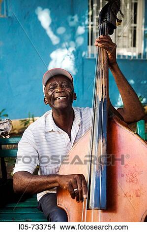 Street musician in Santiago de Cuba, Cuba. View Large Photo Image Picture - Street musician in Santiago de Cuba, Cuba.. Fotosearch