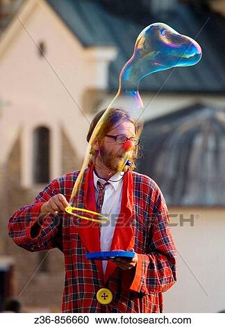 Street performer makes babbles at Main Market Square, Krakow, Poland View Large Photo Image Stock Image - Street performer makes babbles at Main Market Square, Krakow, Poland. Fotosearch