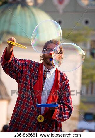 Street performer makes babbles at Main Market Square, Krakow, Poland View Large Photo Image Stock Image - Street performer makes babbles at Main Market Square, Krakow, Poland. Fotosearch