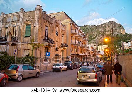 Street scene at dusk with La Rocca mountain Cefalu town Sicilia Italy Europe View Large Photo Image Stock Photo - Street scene at dusk with La Rocca mountain Cefalu town Sicilia Italy Europe. Fotosearch