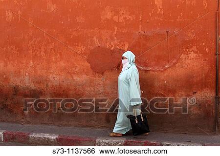 Street scene, old woman walking, Marrakesh, Morocco, Africa View Large Photo Image Stock Photograph - Street scene, old woman walking, Marrakesh, Morocco, Africa. Fotosearch
