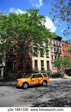 Stock Photograph - Street Scene, Taxi, Apartment Buildings, East Village, Manhattan, New York City, USA. Fotosearch