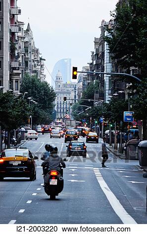 Street. Traffic. Road to the end. Signs on the road. Traffic light. Motorcycle and cars. At the bottom of all: Vela Hotel. Barcelona, Catalonia, Spain. View Large Photo Image Stock Image - Street. Traffic. Road to the end. Signs on the road. Traffic light. Motorcycle and cars. At the bottom of all: Vela Hotel. Barcelona, Catalonia, Spain.. Fotosearch