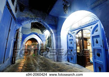 Picture - Street with arches in the medina of Chefchaouen, Morocco.. Fotosearch