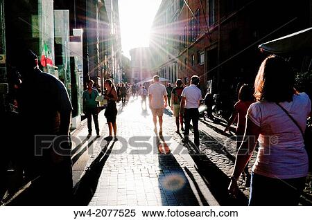 Stock Photography - Street with people in late afternoon, Trevi district, Rome, Italy.. Fotosearch