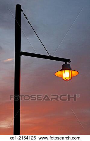 Streetlight at sunset, Calaf, Catalonia, Spain View Large Photo Image Stock Photograph - Streetlight at sunset, Calaf, Catalonia, Spain. Fotosearch