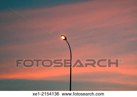 Streetlight at sunset, Montcada i Reixac, Catalonia, Spain View Large Photo Image Stock Photograph - Streetlight at sunset, Montcada i Reixac, Catalonia, Spain. Fotosearch