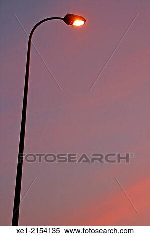 Streetlight at sunset, Montcada i Reixac, Catalonia, Spain View Large Photo Image Stock Photography - Streetlight at sunset, Montcada i Reixac, Catalonia, Spain. Fotosearch