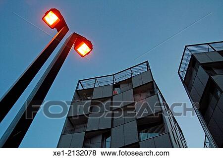 Stock Photo - Streetlight at sunset, residential building, Barcelona, Catalonia, Spain. Fotosearch