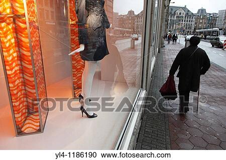 Stock Image - Streetscene of Amsterdam during a rainy day, Netherlands. Fotosearch