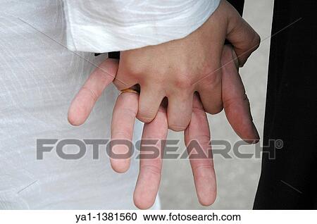 Stressed hands of a fresh couple during their marriage, France View Large Photo Image Stock Image - Stressed hands of a fresh couple during their marriage, France. Fotosearch