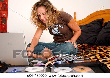 stressed young woman doing a disaster recovery View Large Photo Image Stock Image - stressed young woman doing a disaster recovery. Fotosearch