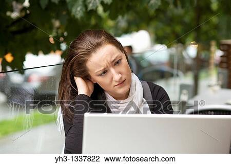 Stressed young woman with a laptop outdoor View Large Photo Image Stock Image - Stressed young woman with a laptop outdoor. Fotosearch