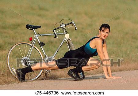 stretching before a bike ride View Large Photo Image Stock Photograph - stretching before a bike ride. Fotosearch