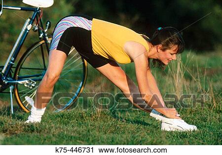 stretching before biking View Large Photo Image Stock Image - stretching before biking. Fotosearch